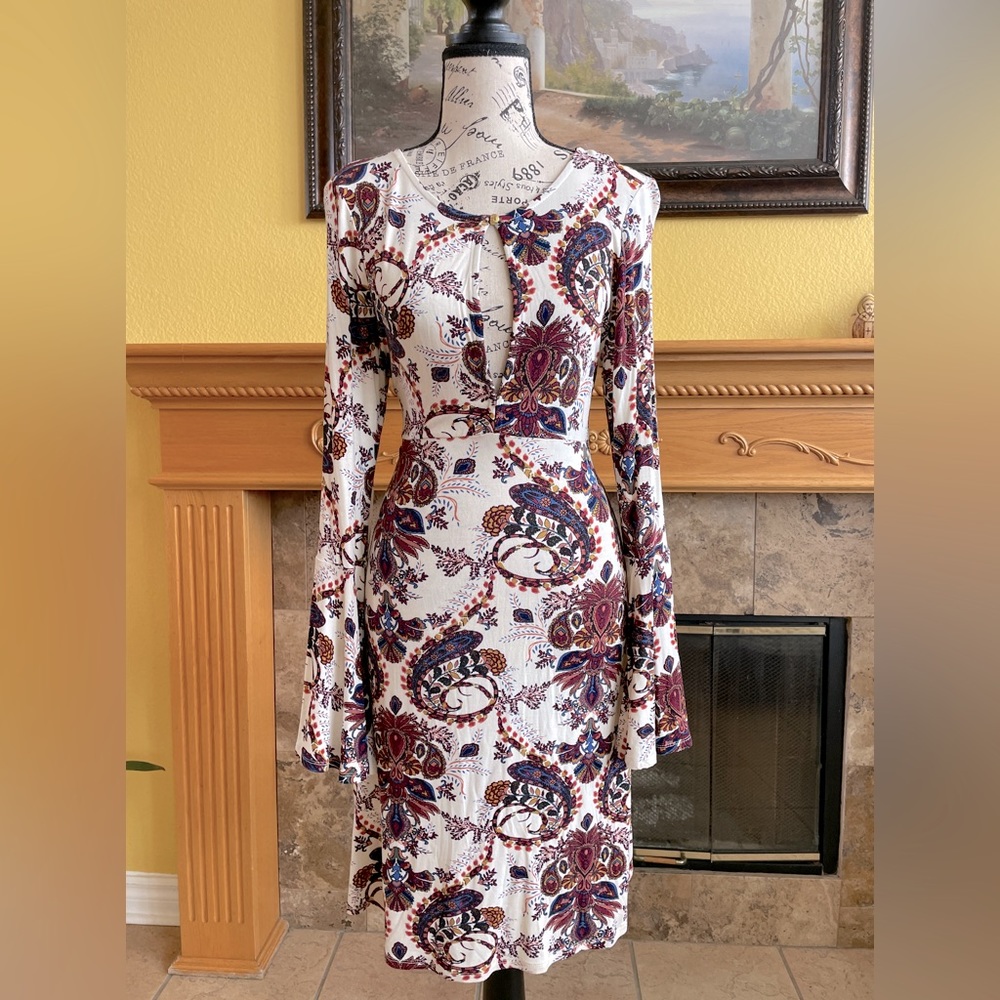 Bodycon stretchy material dress, long sleeve with a pronounce neckline